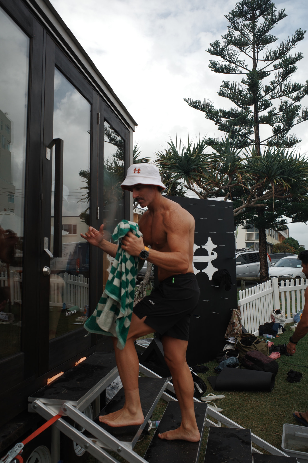 Jordan Chenery stepping into a beachside sauna on the Gold Coast