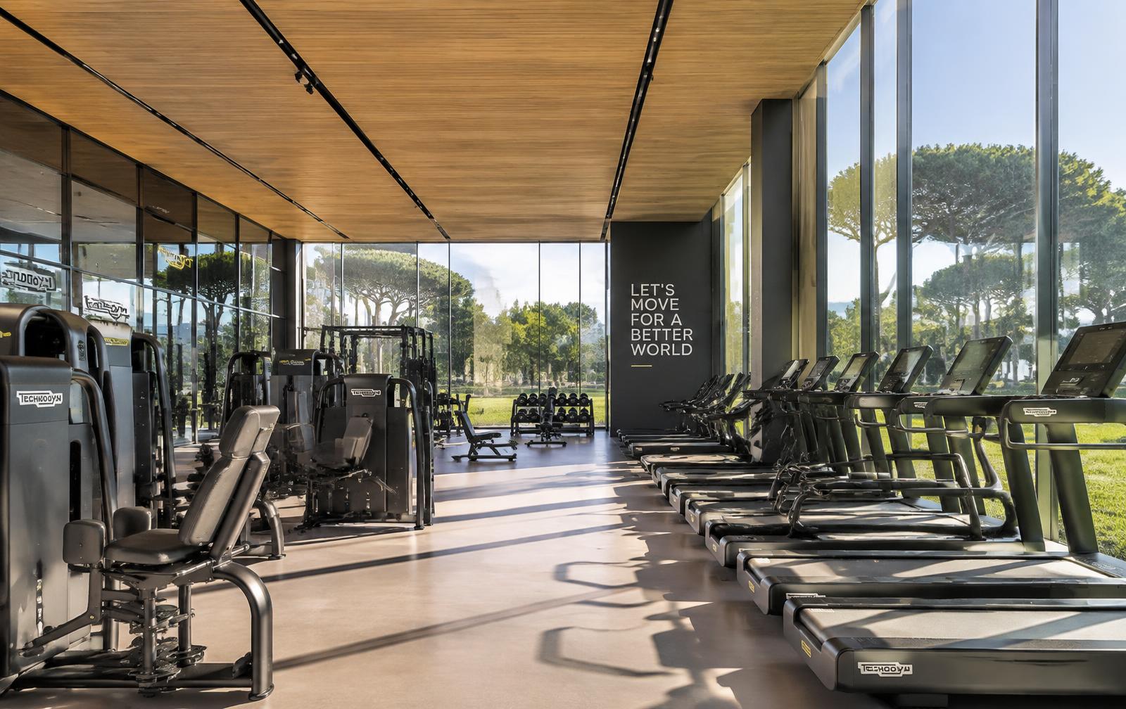 Technogym Village wellness centre interior with premium equipment and parkland views